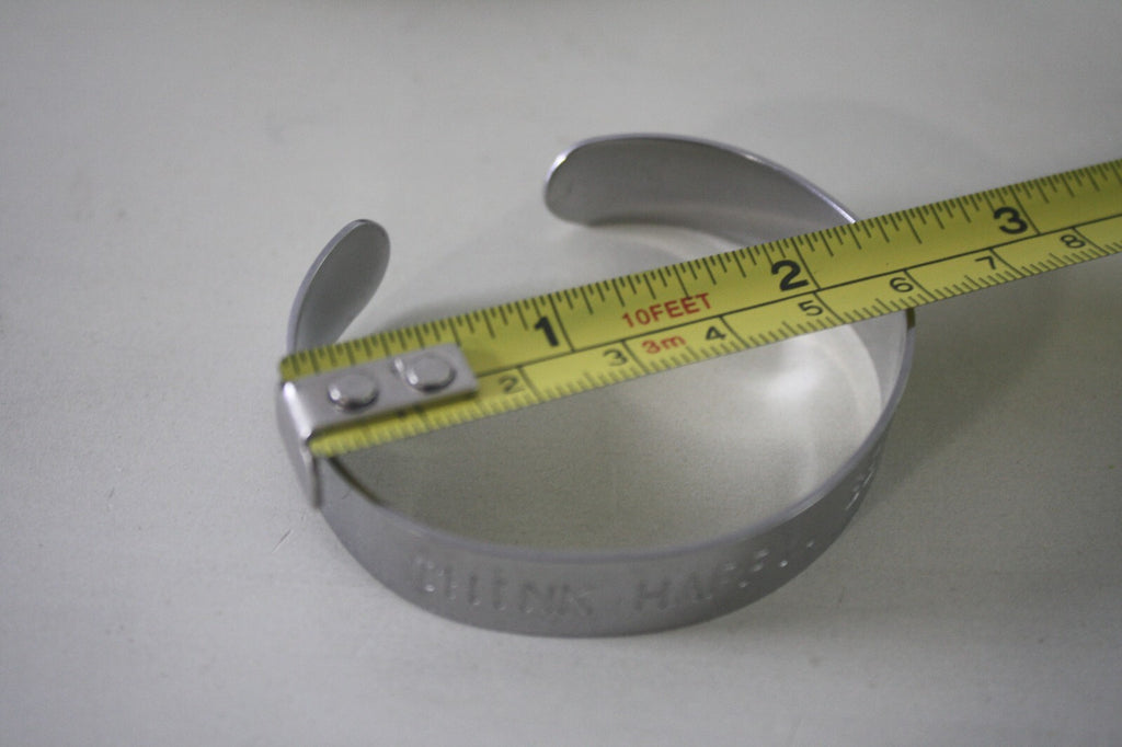 Adjustable Silver Metal Cuff Bracelet with Engraved 'THINK HAPPY. BE HAPPY.'
