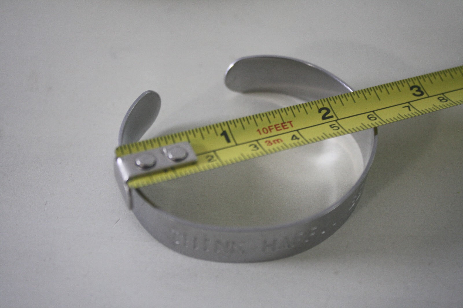 Adjustable Silver Metal Cuff Bracelet with Engraved 'THINK HAPPY. BE HAPPY.'