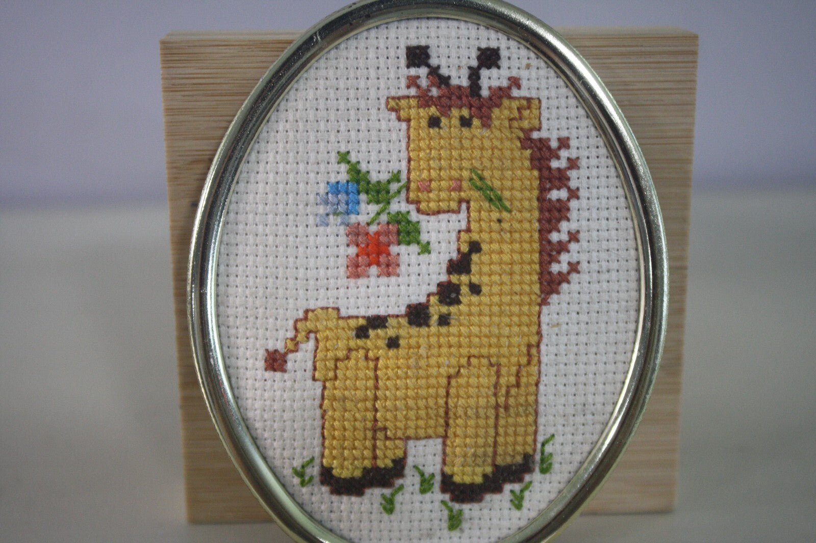 Handmade Cross Stitch Giraffe in Oval Silver Frame