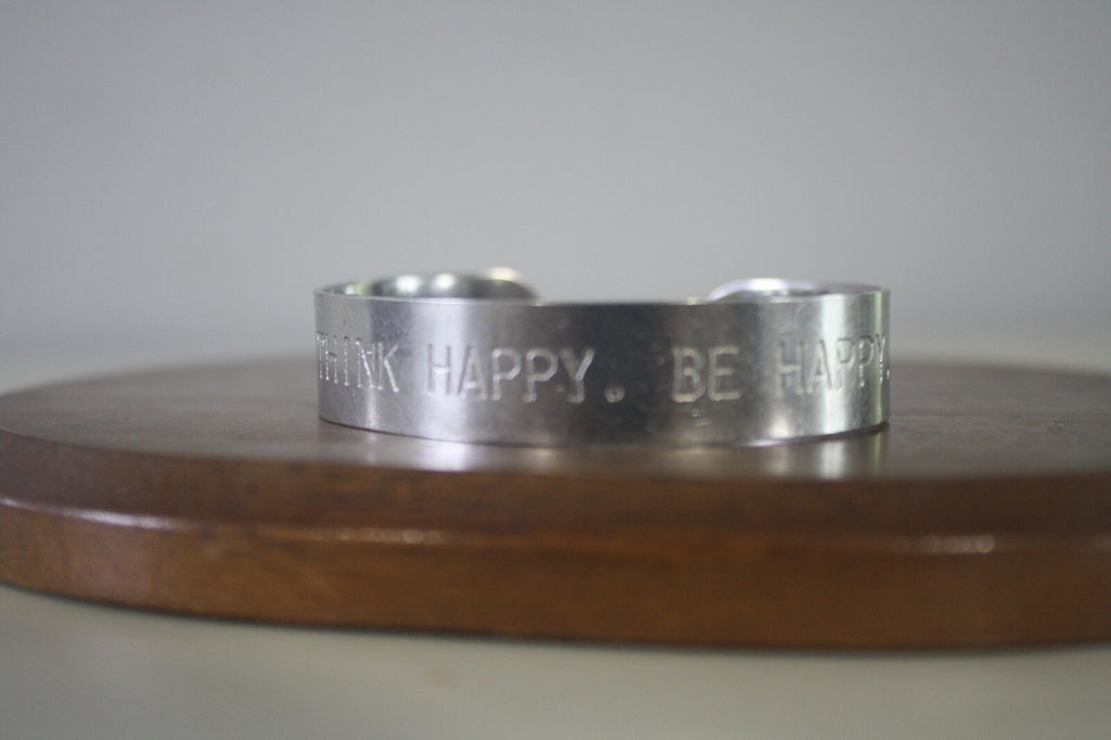 Adjustable Silver Metal Cuff Bracelet with Engraved 'THINK HAPPY. BE HAPPY.'