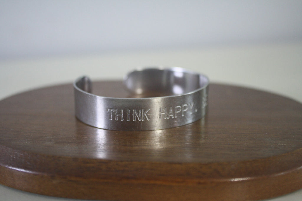 Adjustable Silver Metal Cuff Bracelet with Engraved 'THINK HAPPY. BE HAPPY.'