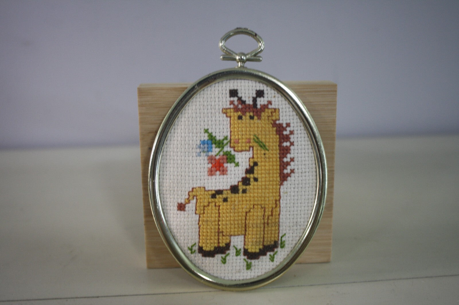 Handmade Cross Stitch Giraffe in Oval Silver Frame
