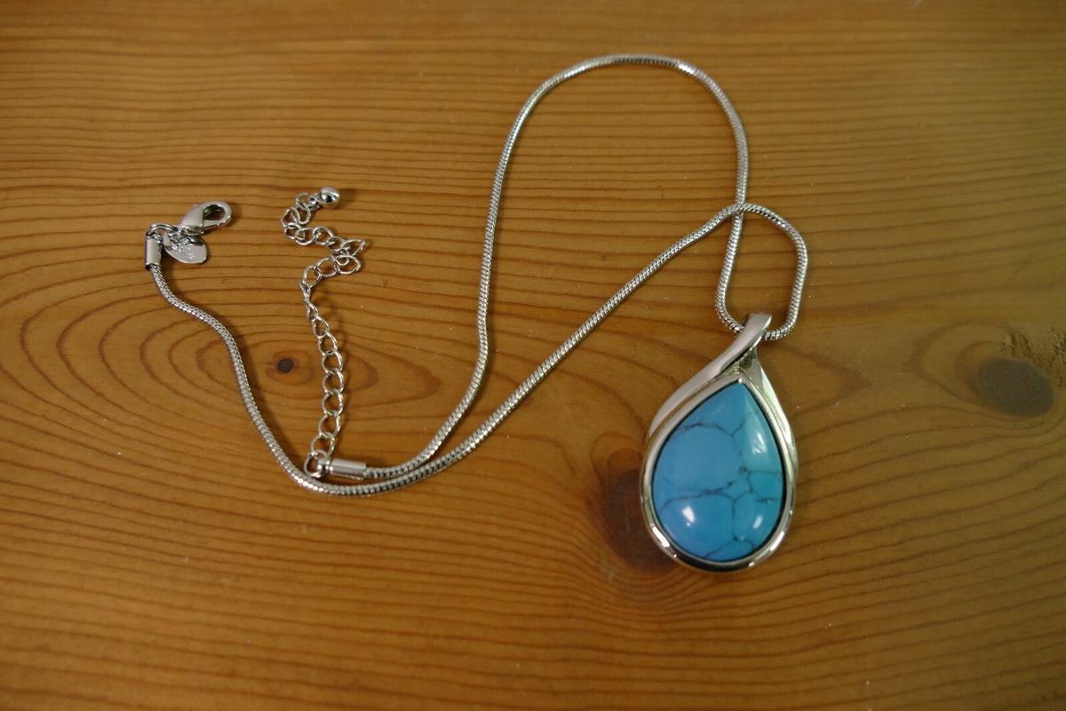 Silver Toned Lia Sophia Necklace with Teardrop Turquoise Pendant